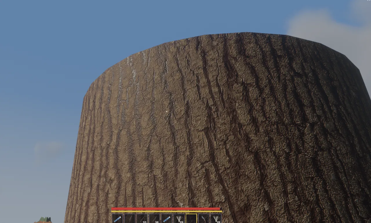 A tree trunk filling the sky, bark in full detail.