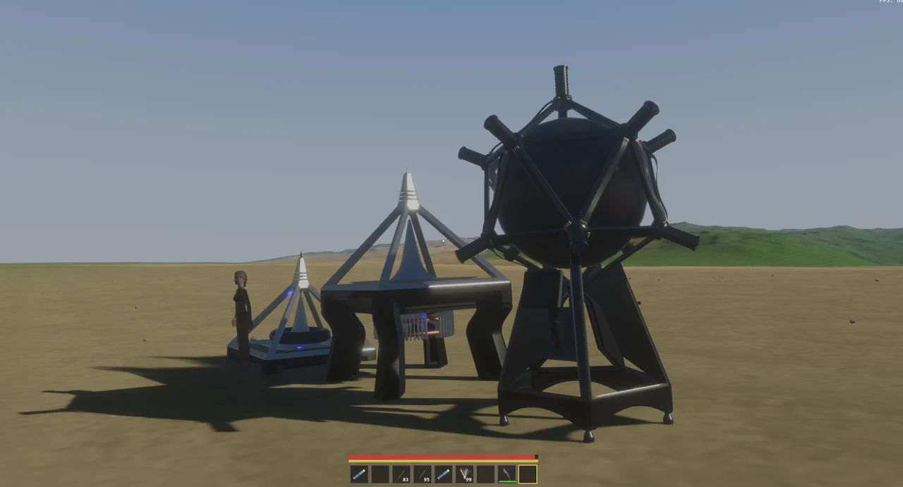 The Logos Drive on its own and on its new stand, beside the Shell Emitter, with a player for scale.