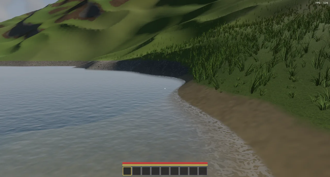 A grassy shoreline at 126 fps, the lake bed showing through the shallows.