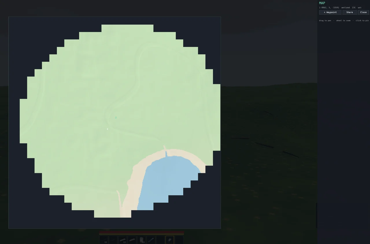 The map, still a work in progress: an explored circle of grassland with a river winding through it and a lake on its edge, the unexplored ground dark around it.