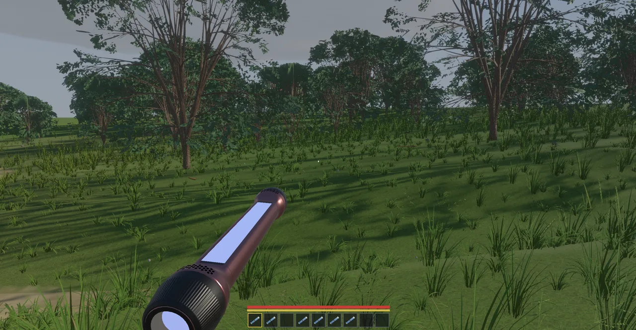 The Scroll held closed in first person, a tube with a light on the end, in a grassy field.