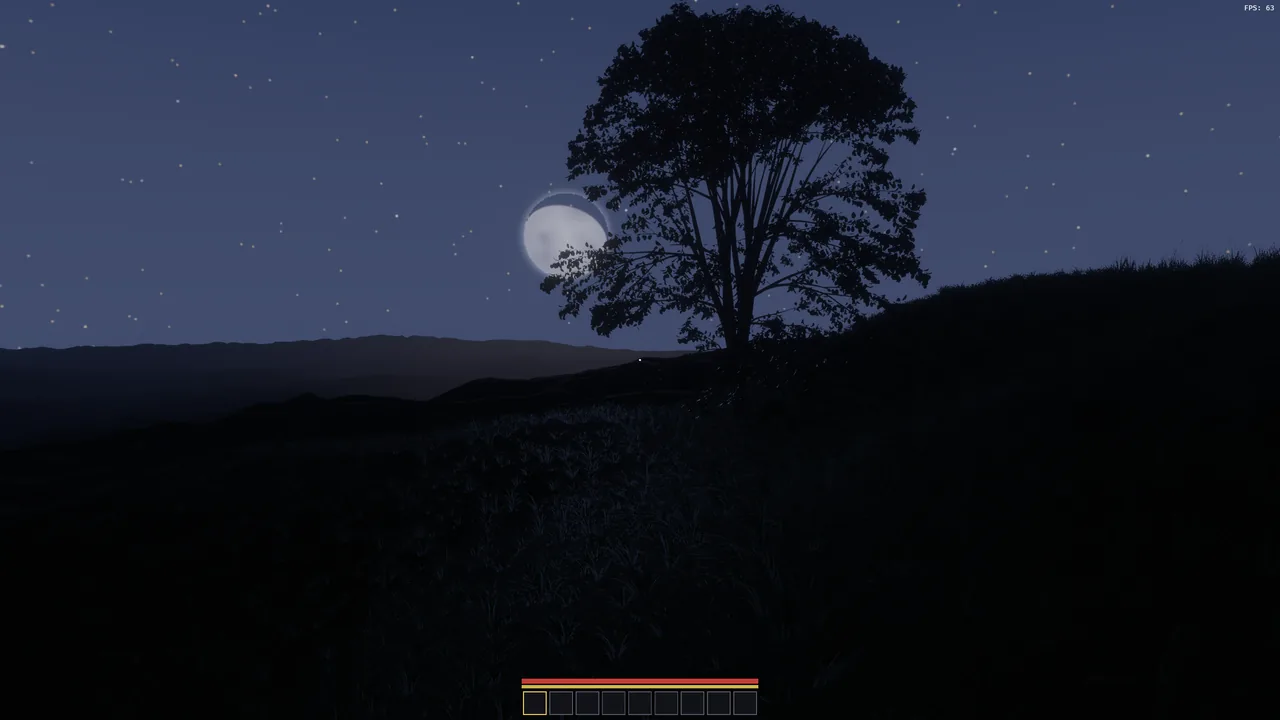 A tree silhouetted against the moon on a starry night.