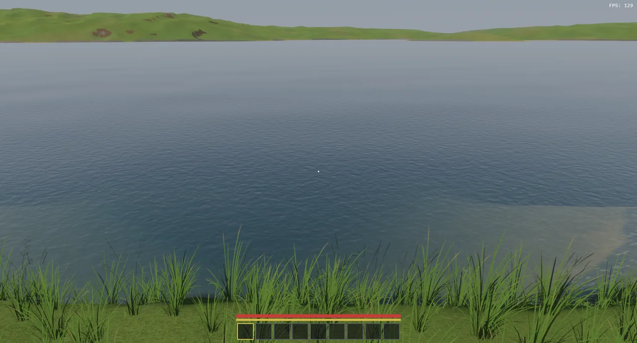 Open water from the bank, fine ripples across the surface and a sandbar showing through the shallows.