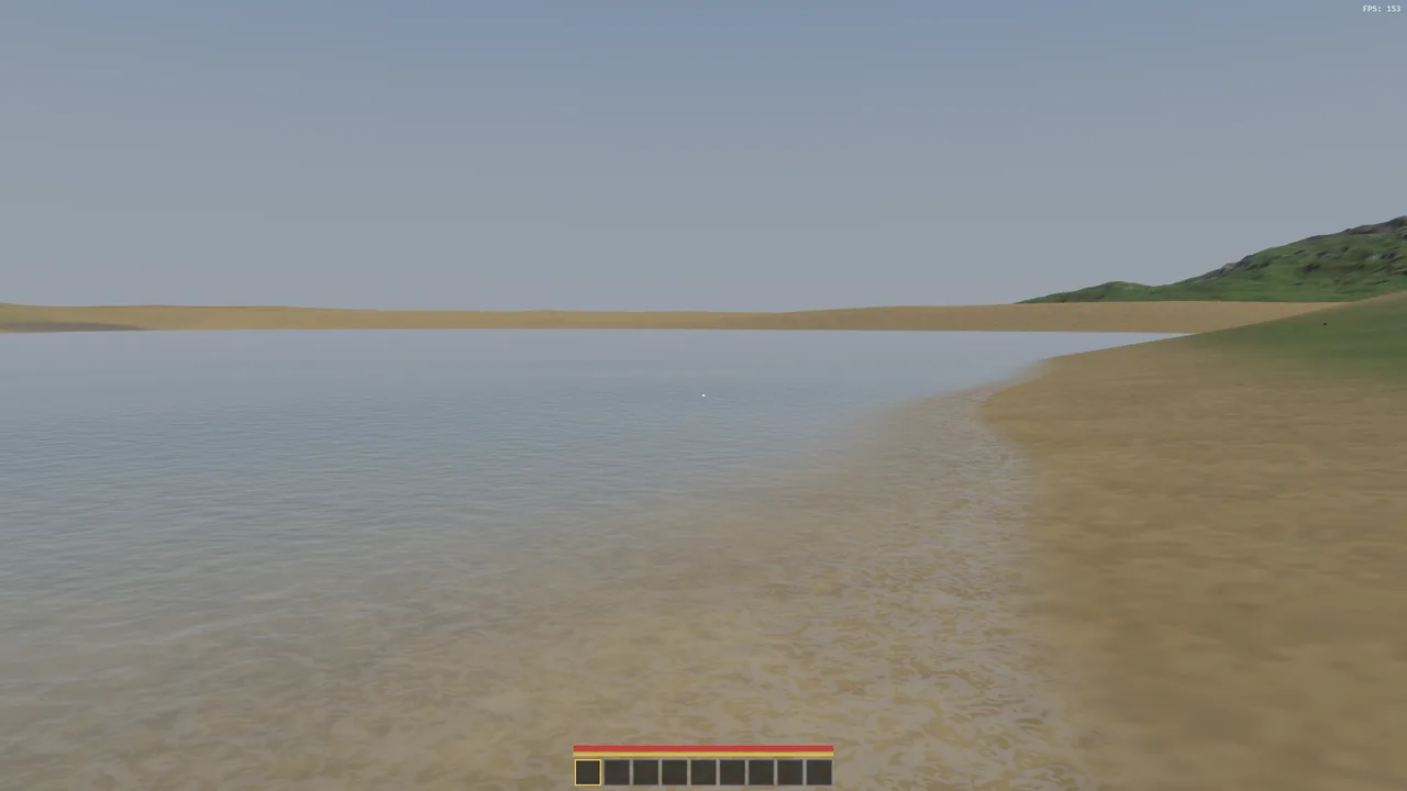 The new water at a sandy beach, the sand bed clearly visible through the shallows before it fades into deeper water.